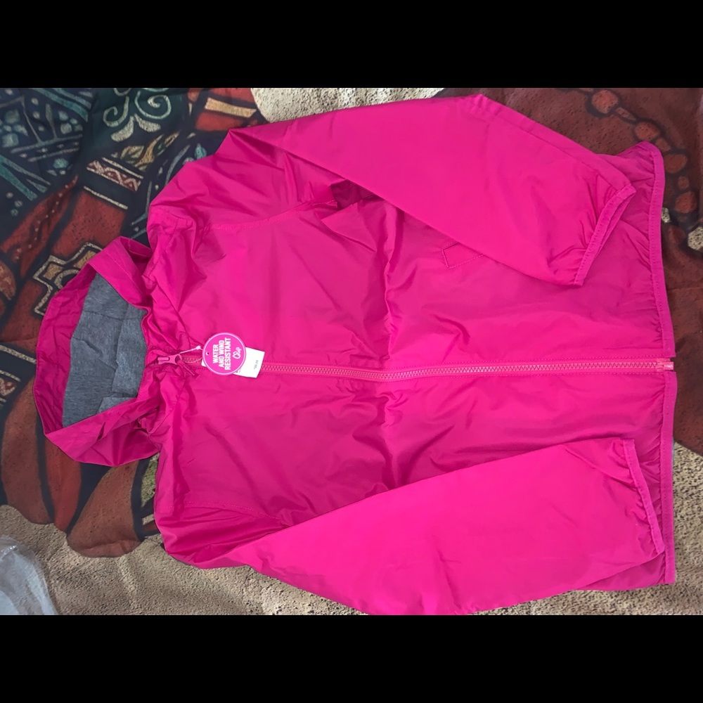 Children place rain jacket